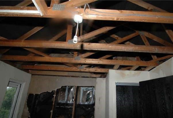 Top floor of property showing fire damage to party wall.jpg