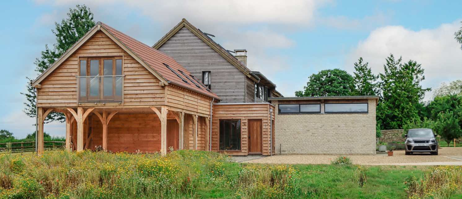 3 to 4 Bay Oak Framed Car Port With Room Above Linked To House.jpg