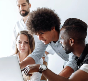 CIOB Staff discussing topic over laptop 350.jpg